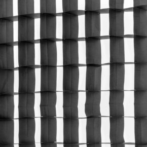 1643039207_361 The Westcott 40 Degree Egg Crate Grid for Stripbank Switch & Stripbank creates a black-and-white abstract grid pattern in which light and shadow alternate, producing a three-dimensional, undulating surface effect.