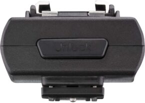 1644397549_263 Front close-up of the black accessory for the Westcott FJ Wireless Adapter for Sony camera, with metal connectors and a button in the middle to unlock, against a white background.