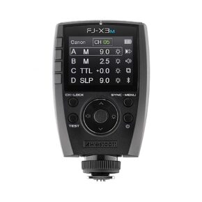 1664871122_871 The Westcott FJ-X3m Universal Wireless Flash Trigger for Canon has a black body, a colour display for flash group settings, channel and controls, several buttons and a rotary selector below the display.
