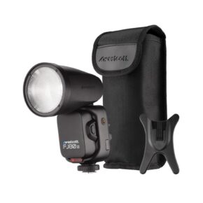 1665038269_512 The Westcott FJ80 II M Universal Touchscreen 80Ws Speedlight in black, with matching carrying case and plastic stand, is presented on a white background.