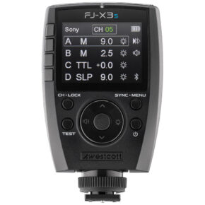 1685614088_681 A close-up of the Westcott FJ-X3s wireless flashgun with Sony camera mount shows a digital display with four channels (A, B, C, D) and several control buttons below the screen.
