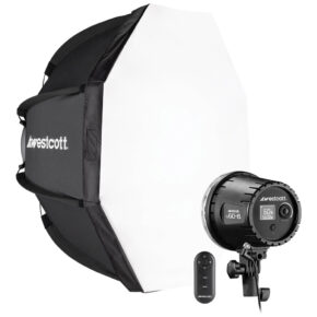 1707397366_422 The Westcott U60-B Bi-Color LED 1-Light Softbox Kit (60W) is a studio lighting kit with a large octagonal softbox, a studio light with rear controls and a small wireless remote control, all with the Westcott logo.