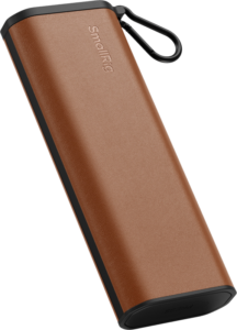 800q-01_134139 The SmallRig 5361 Multifunctional Card Reader & Storage Case CFexpress Type A is a brown, rectangular device with rounded edges, black trim, built-in carabiner clip and SmallRig branding on the surface.