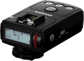800q-01_108189 A Hähnel Viper TTL Canon transmitter and receiver, black camera flash trigger with digital display, buttons, red control knob and power switch presented on a beveled white background.