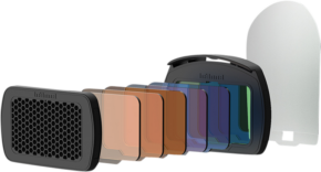 800q-01_112752 The Hähnel Module Light Effects Kit - flash equipment is presented in a line with coloured and transparent filters, a black filter holder, a honeycomb filter at one end and a large transparent filter at the other.