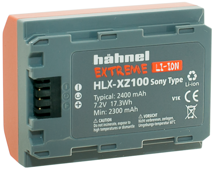 800q-01_123371 Harmaa Hähnel Battery Extreme Sony HLX-XZ100 / NP-FZ100 -akku, jossa on oranssit korostukset, merkintä 2400 mAh, 7.2V, 17.3Wh, sopii Sony-kameroihin, ja siinä on sertifiointi- ja varoitussymbolit.