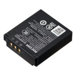 The rectangular Ricoh Rechargeable Battery DB-120, with gold-coloured pins, white text, icons and QR code on top, appears diagonal against a white background.