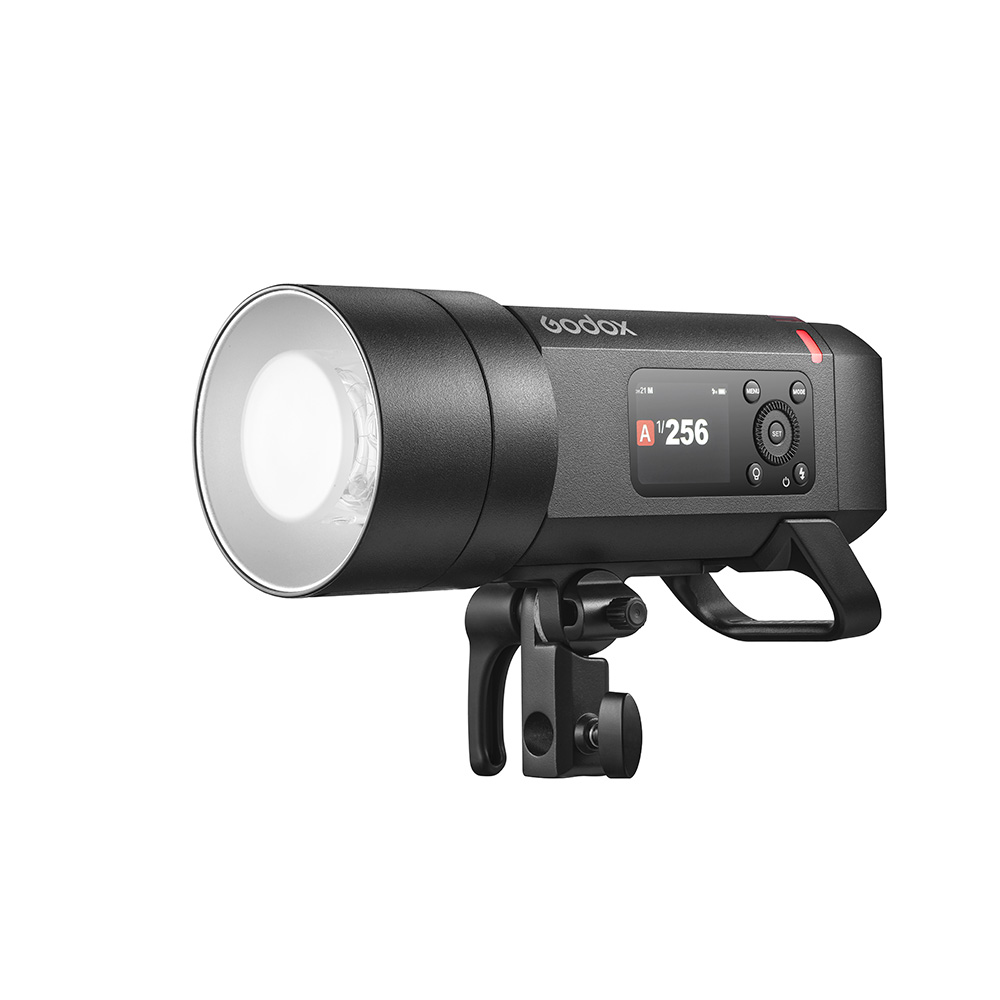 godox_ad400_pro_ii The Godox Witstro AD400 Pro II, a black studio strobe with digital display and control buttons, is mounted on an adjustable bracket and insulated on a white background.