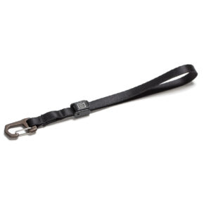 The BlackRapid TetheR Nylon wrist strap, patterned in a flat white finish, has a metal carabiner clip at one end and a loop handle at the other.