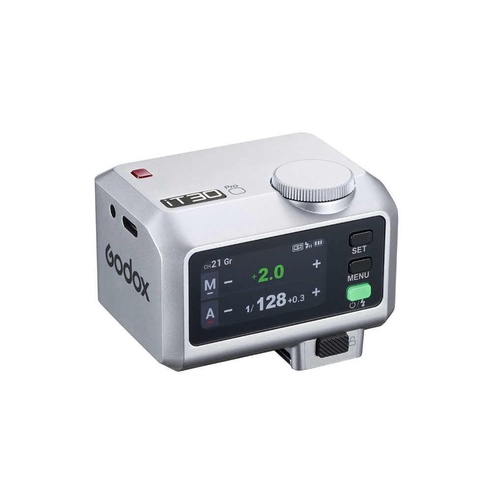 1747920217_061 Godox iT30Pro O Silver iFlash TTL -kamerasalamassa on digitaalinen näyttö, säätöpainikkeet, suuri säätöpyörä ylhäällä ja Godoxin logo sivulla.