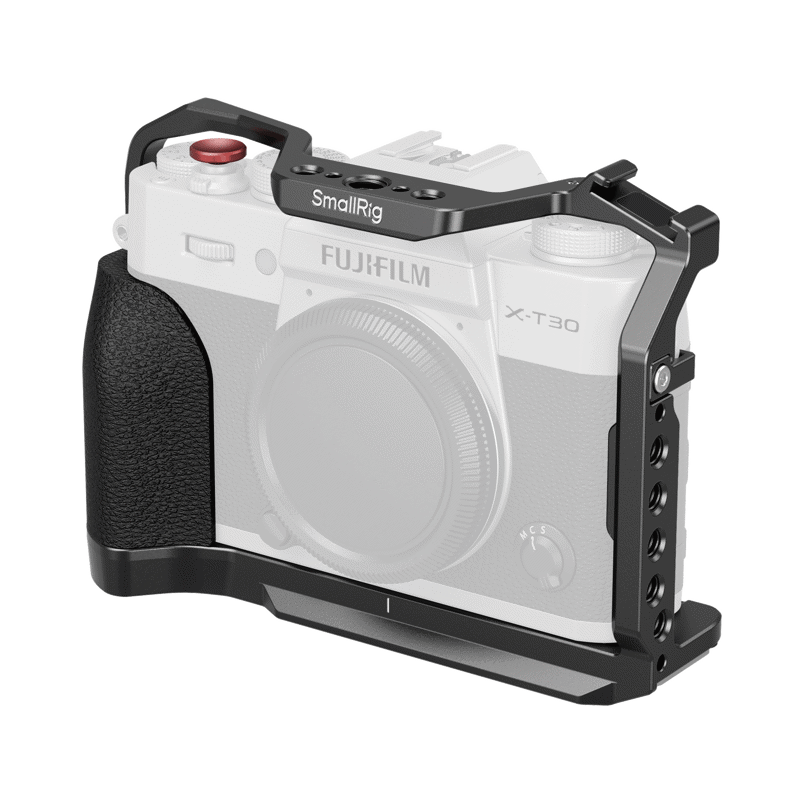 800q-5662-1 SmallRig 5662 Cage for Fujifilm X-T30/II/III -kehikko mustaa metallia asennetaan Fujifilm X-T30 -kameraan, joka tarjoaa ylimääräisiä kiinnityspisteitä ja suojaa, mutta pitää hallintalaitteet saatavilla. Kamera on esitetty osittain läpinäkyvänä häkin korostamiseksi.