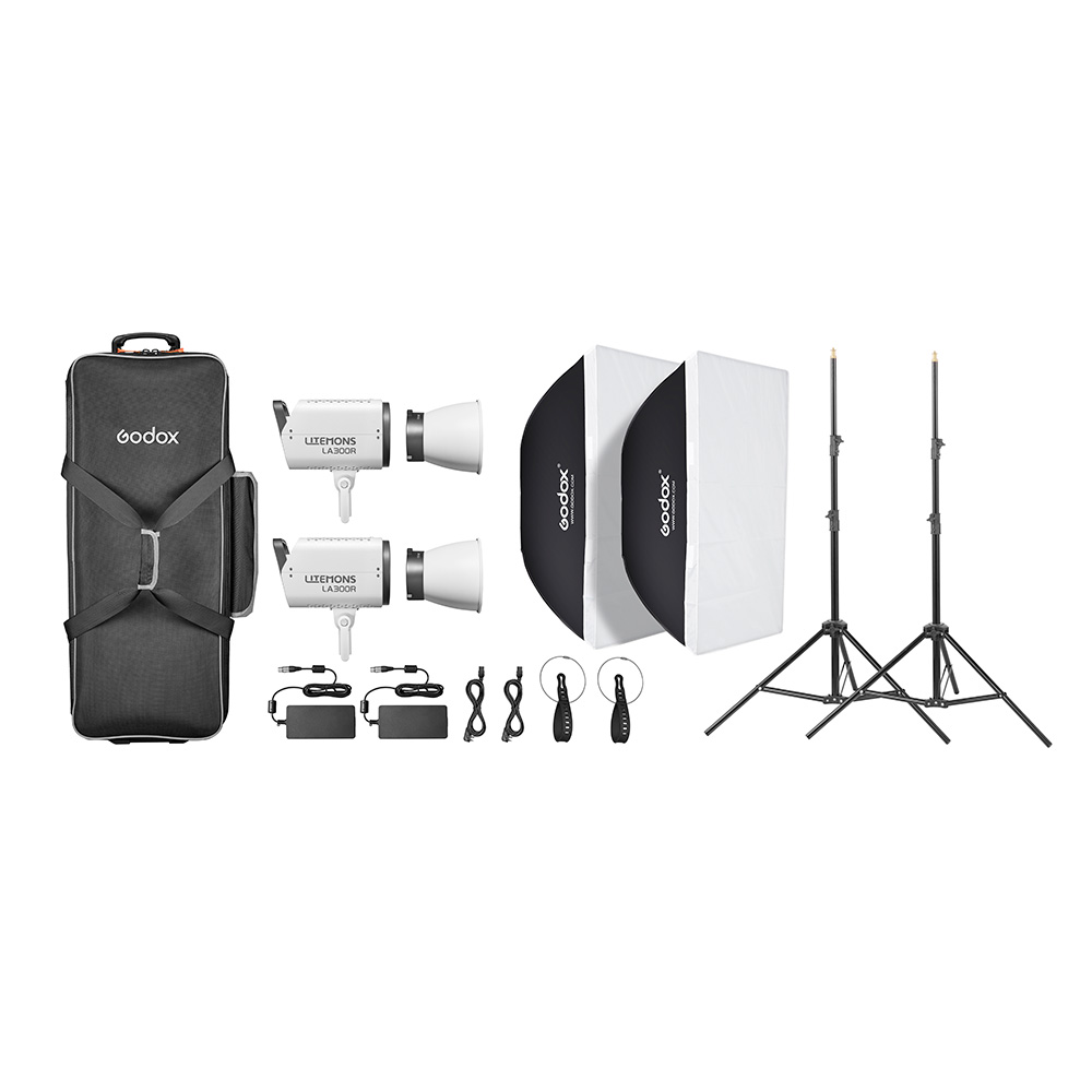 1727427938_209 Godox Litemons LA300R RGB LED Video Light 2 Light Kit Valkoinen sisältää kaksi LED-valoa, suorakulmaiset softboxit, valotelineet, virtajohdot, kaukosäätimet, heijastinlautaset ja mustan kantolaukun, jotka on järjestetty valkoiselle taustalle.