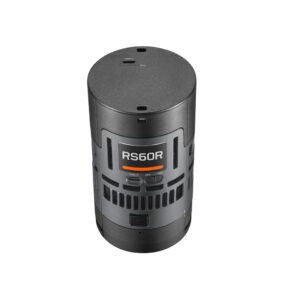 1744882043_617 Godox Litemons RS60R RGB LED Light 1 Light Kit, lieriön muotoinen musta elektroninen laite, jonka etupuolella on painikkeita ja tuuletusaukkoja, näkyy valkoista taustaa vasten.