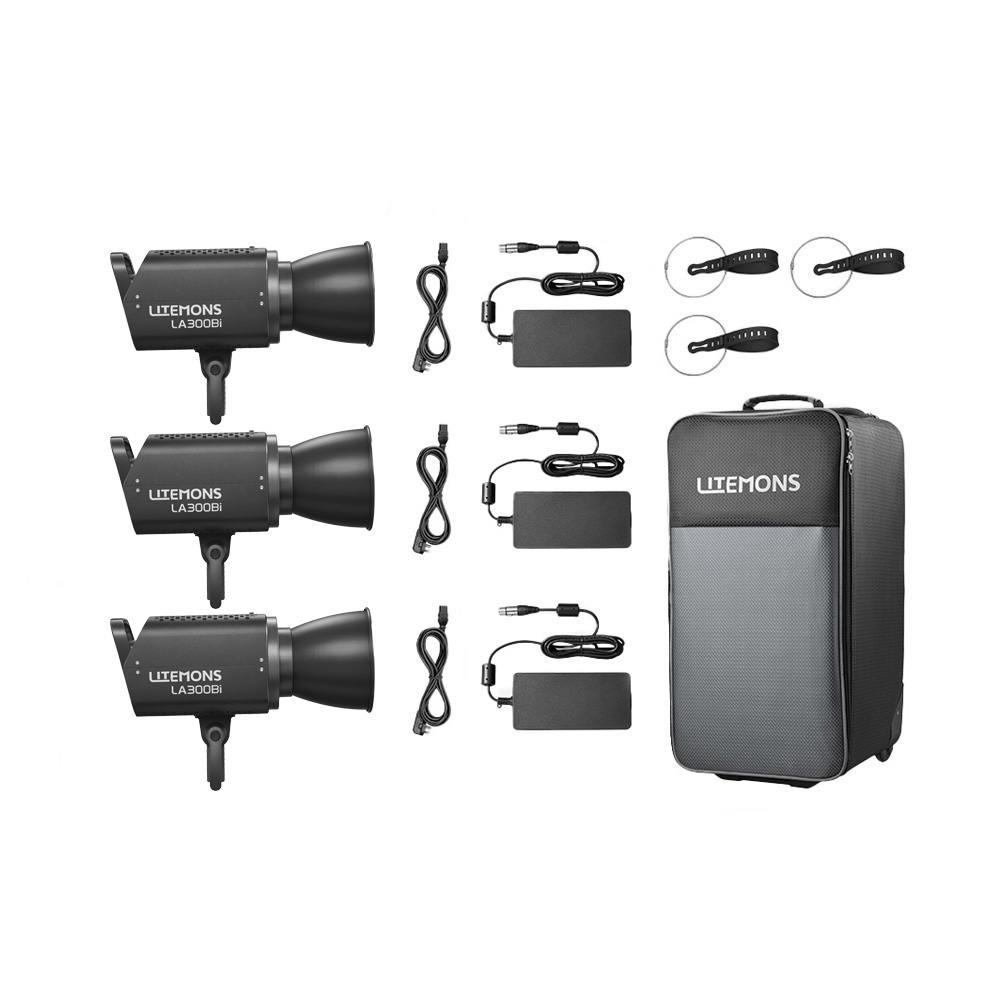 1751356007_817 Godox Litemons LA300Bi Bi-Color LED Video Light 3 Light Kit Musta sisältää kolme mustaa LA300Bi-valoa, virtajohdot, adapterit, heijastimet ja suuren harmaan LITEMONS-merkkisen kantolaukun.